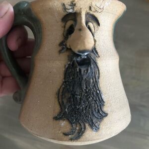 Stoneware coffee mug with face
